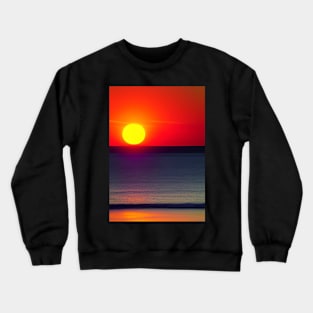 RED SUNSET OVER THE OCEAN FROM THE BEACH Crewneck Sweatshirt